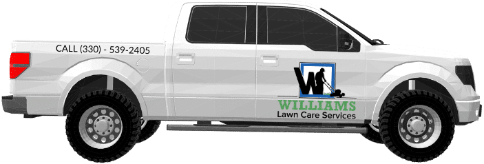 A  Williams Lawn Care Services work truck. The truck is white with the logo for Williams Lawn Care Services on the side.